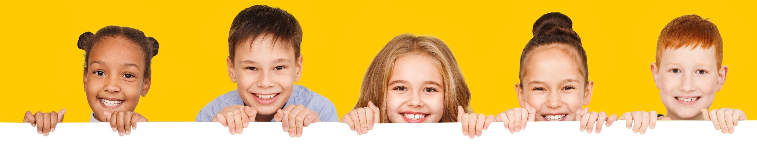 Happy,Children,With,Empty,Board,For,Your,Text,Isolated,Over